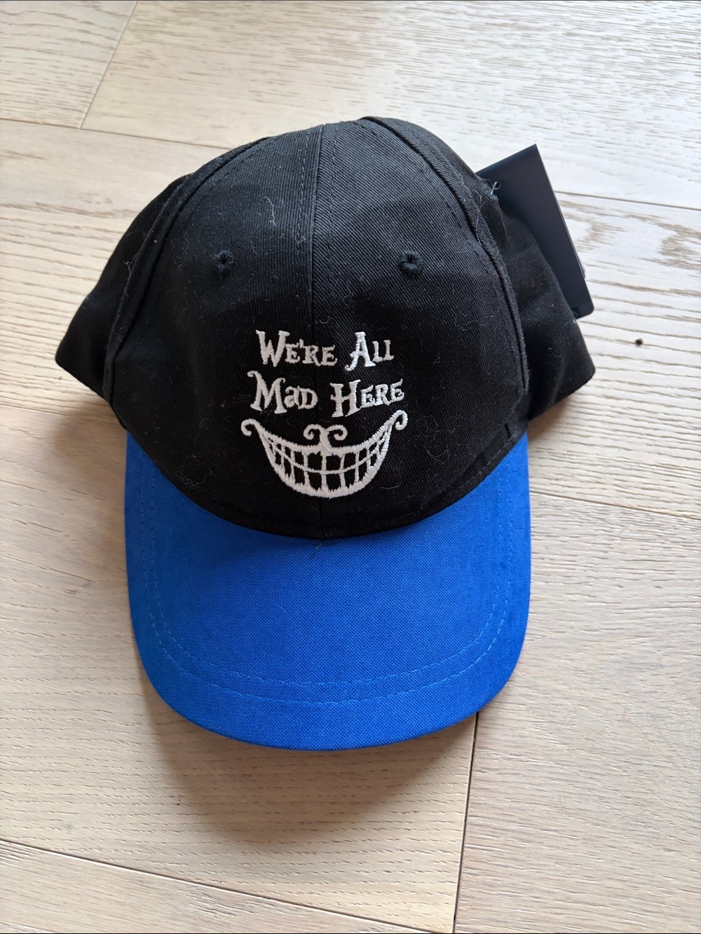 Black & Blue 'We're All Mad Here' Baseball Cap